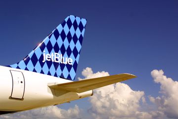 A JetBlue Airways jet sits on the tarmac at the Ft. Lauderdale/Hollywood International airport