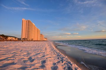 A view of Panama City Beach with hotels and the ocean at sunset in Florida USA