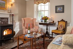 Living room area in Candleberry inn with a fireplace