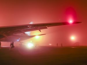 Wing of an airplane in the evening fog at Casablanca Airport