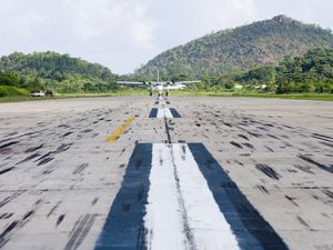 Air Seychelles DHC-6 Twin Otter aeroplane taxiing at Praslin Airport.