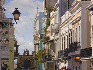 Street scene in San Juan Puerto Rico with City Gate in background.