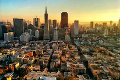 High Angle View Of Modern Cityscape During Sunset