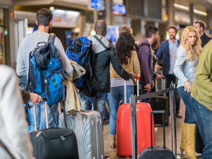 Business people standing in queue at airport