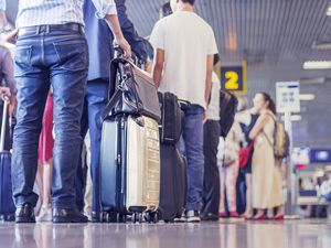 People waiting in line at an airport