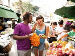 Couple shopping in outdoor market, Bangkok, Thailand