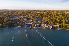 Aerial of Small Village on Lakeshore in Autumn