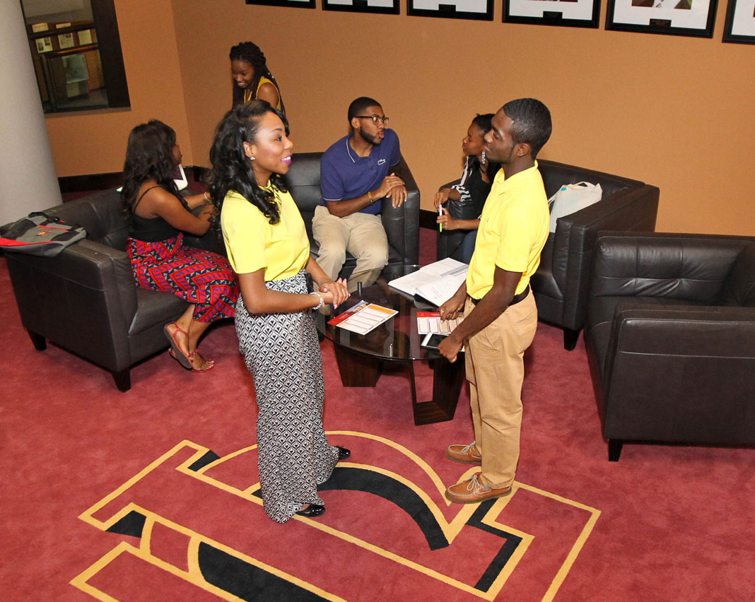 students in a room talking amongst themselves