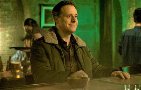 Alan Tudyk at the bar in Resident Alien - Season 1