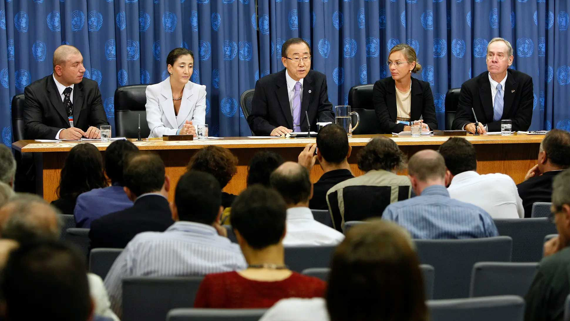 Former Secretary-General Ban Ki-moon addresses a press conference with others next to him