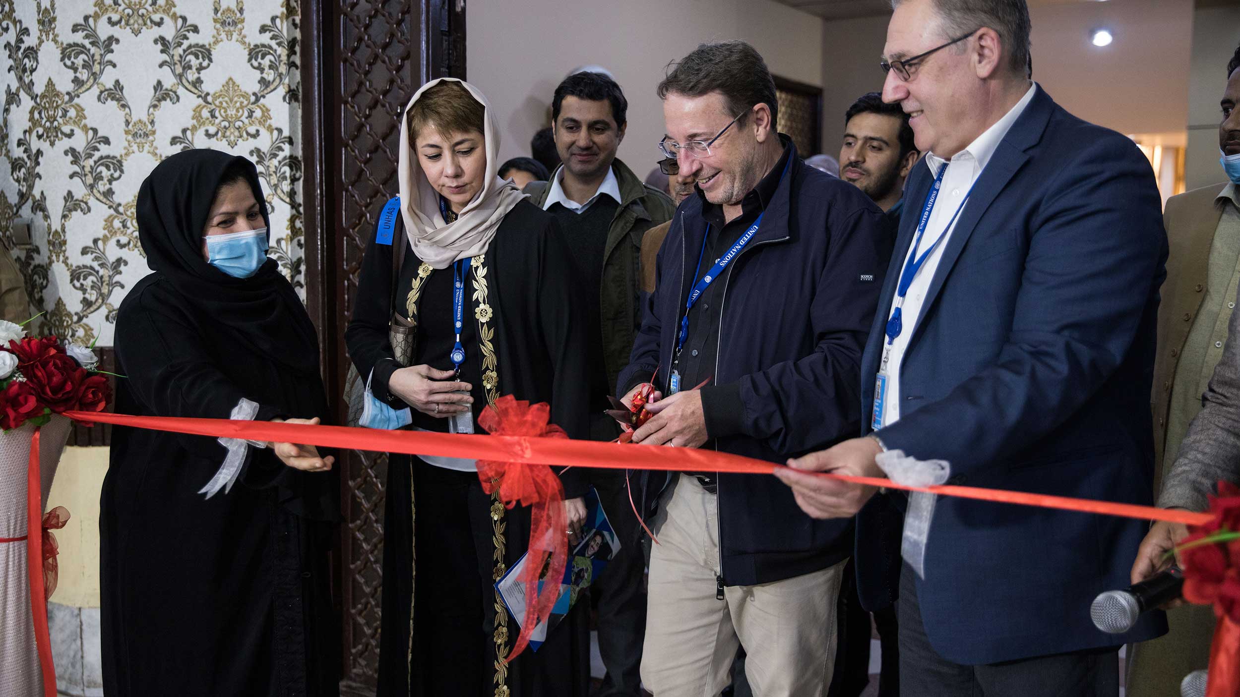 Achim in a ribbon cutting ceremony