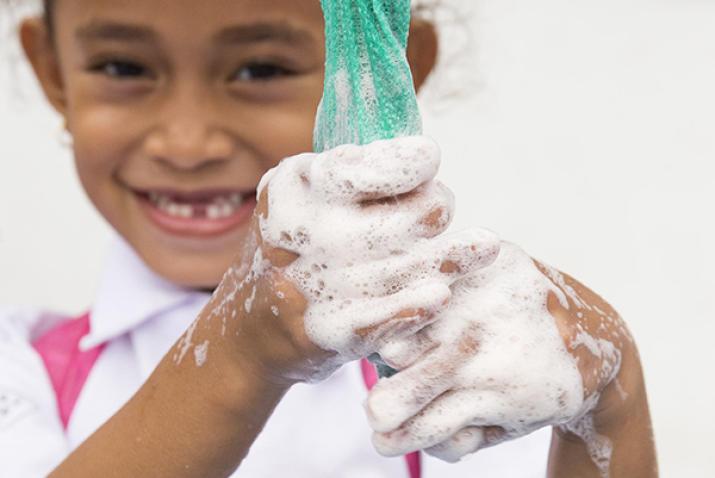 child washing its hands