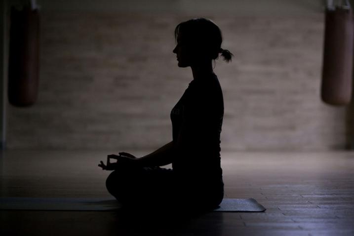 woman sitting in yoga pose