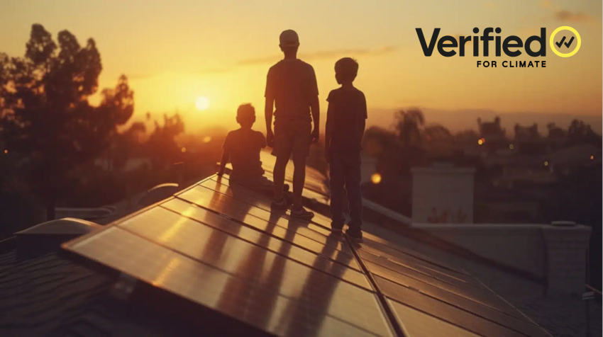 Three boys stand on roof watching the sunset