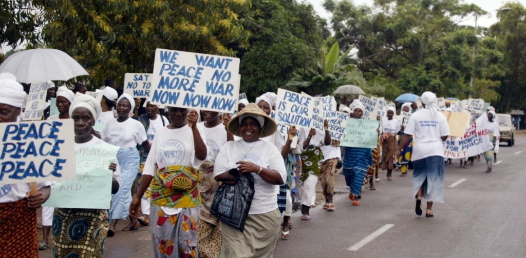 Liberian women marching through the streets of Monrovia agitating for peace.