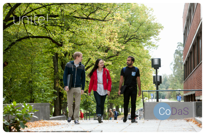 Three students walking in the campus