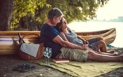 Couple having picnic on beach