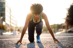 Sprinter woman at start position, Ready to run