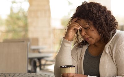 African American middle age woman looking sad.