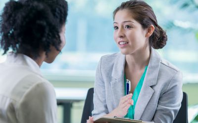 Two women discussing career options