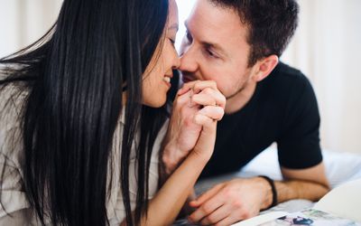 A young woman and man spending time together indoors.