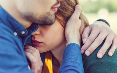 Young man comforting his girlfriend