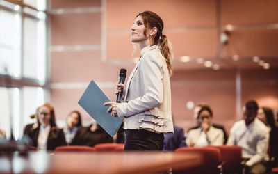 Business People Listening to the Speaker at a Conference