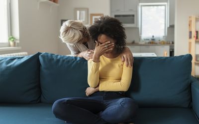 Mother Comforting her Mixed Race Daughter