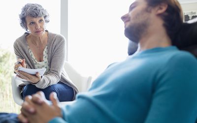 A psychologist talking to a client