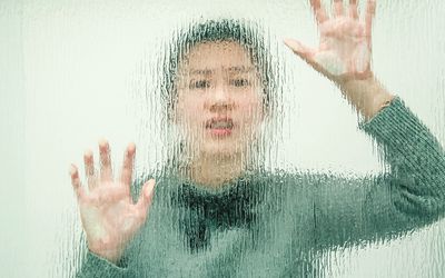 Woman Behind Transparent Wall