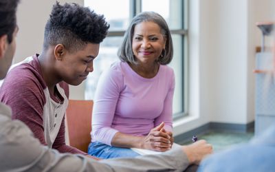 Boy in therapy with family member.