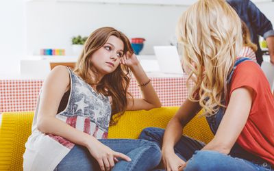 Mother talking with her teenage daughter at home