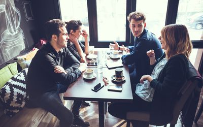 Couple friends having coffee together.