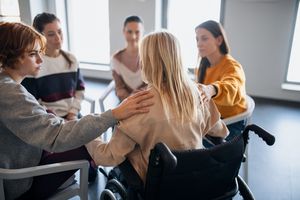 People supporting one another on grief therapy session.