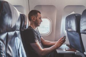 Man seated on an airplane