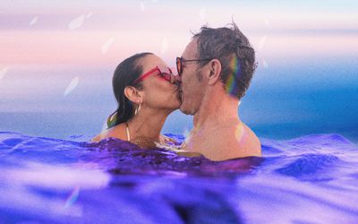 composite of two people kissing while swimming 