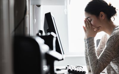 woman stressed and angry at her computer