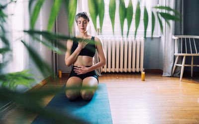 Young woman enjoys the peace and relaxation of deep breath in the comfort and safety of her own home