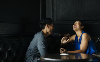 Cheerful couple on a date at a restaurant