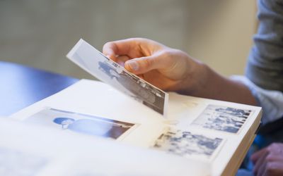 Woman looking through photo album