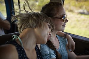 Good friends on a road trip in big old car