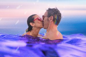 composite of two people kissing while swimming 