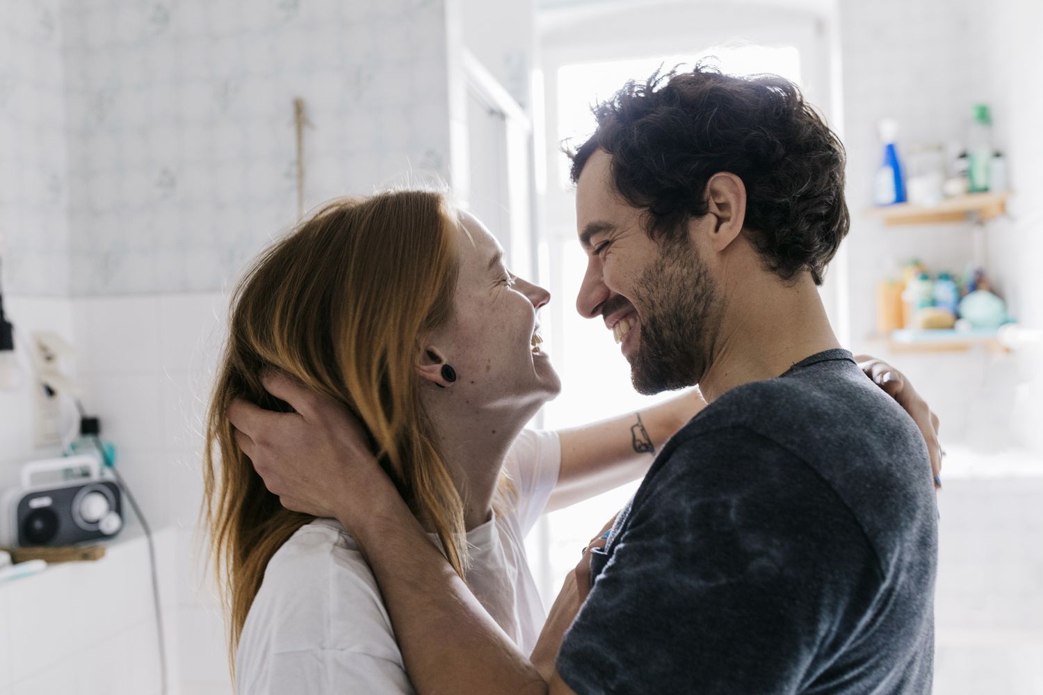 Couple Affectionately Embracing And Smiling Together