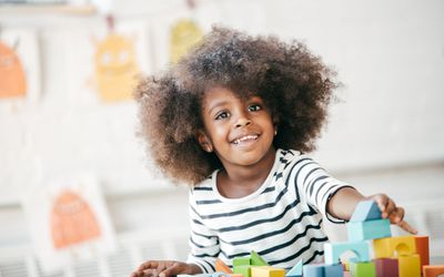 young girl playing with blocks