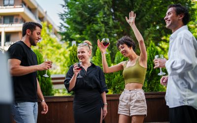 couples partying on a deck outside