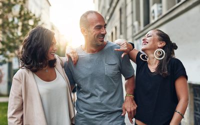 Shot of three friends having fun while out in the city