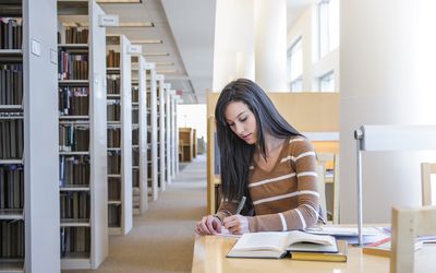 Student studying in a school library