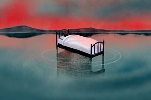 Person sleeping on a bed floating in the water with mountains in the distance