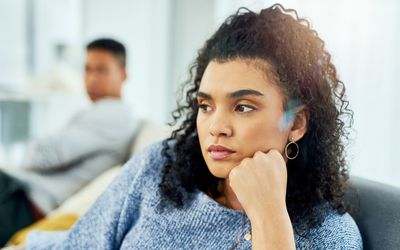 Cropped shot of a young couple having a disagreement at home