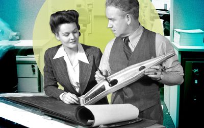 vintage image of a man and a woman looking at data in a book at work